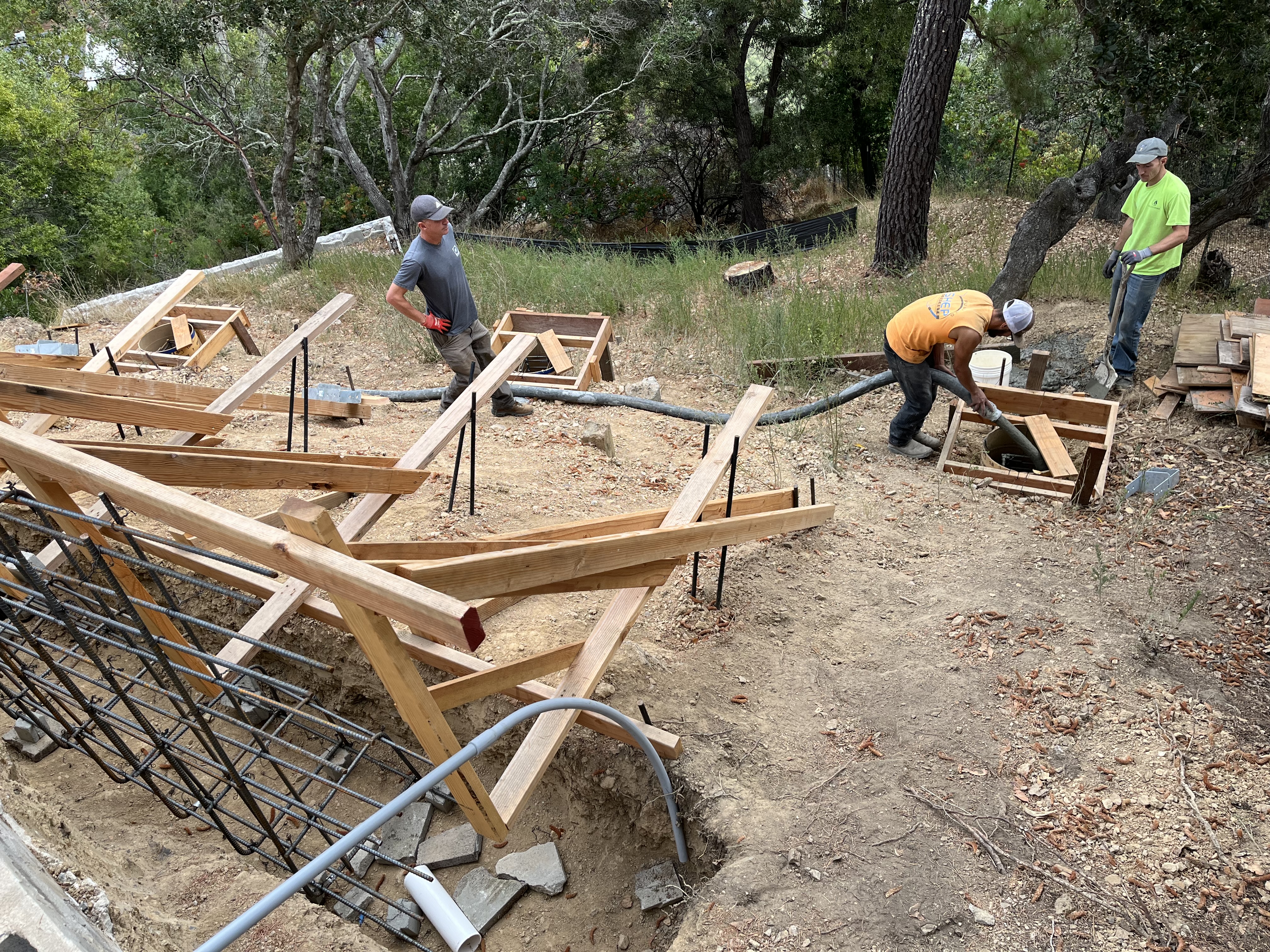 Pouring concrete into foundation form